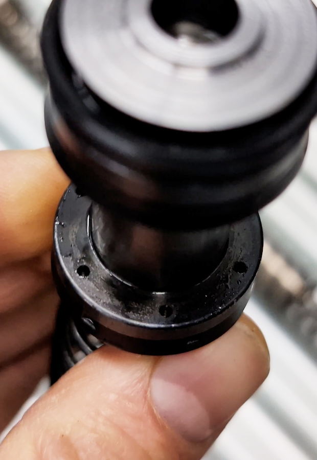 Photo of a Partswise master cylinder piston with recuperation holes